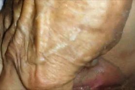 Teasing a mature vagina closeup