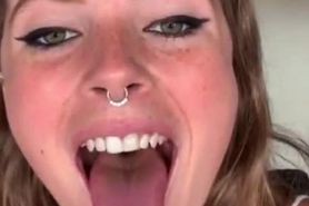 Beautiful face and tongue out girl with nose ring