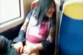 Asian milf rubs her clit on a train