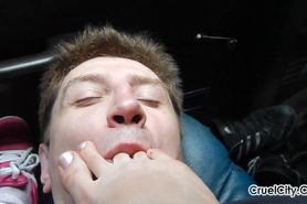 slave licks feet in the car