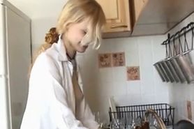 Beautiful girl is masturbing in the kitchen