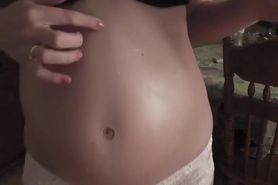 Massaging belly pregnant