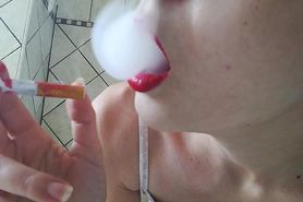 SMOKING ND SUCKING CIGARETTE IN RED LIPS