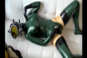 Diving on the sofa in latex