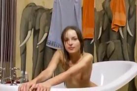 luxury teen testing glass dildo in bath