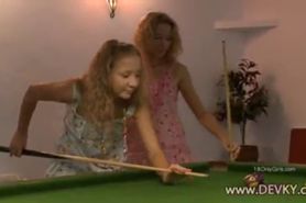 Girls licking on the billiards table