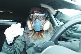 Cute german girl talks with gas mask, gloves and goggles