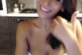 Skinny brunette shows her cute tits