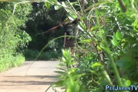 Asian babes piss in park - video 1