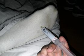 Socked feet injection in bed
