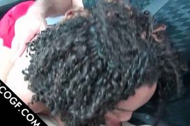 Curly Choco babe giving blowjob in the car