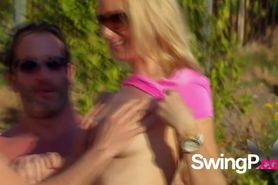 Swingers at the pool are playing blindfolded sex games while on vacations