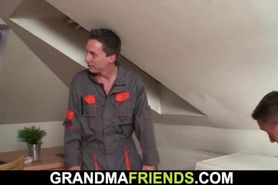 Two repairmen share very old blonde granny
