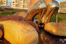 2 mistresses crushing bread in high heels