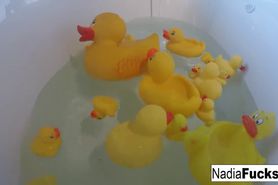 Sexy Nadia takes a bath with some rubber duckies