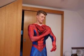 Ripped hunk putting on Spiderman Costume