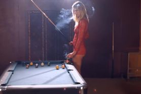 Gorgeous blonde Cougar smoking while shooting pool