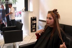 Professional hairdresser cutting hair and pissing over client