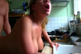 Busty Beauty fucked over the sink