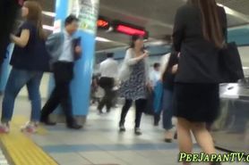 Japanese skank in high heels pisses