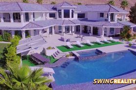 Swinger couple checks out the sexyness of the swingers mansion