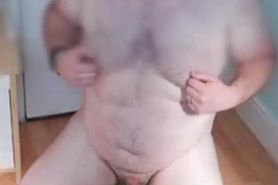 Fat ass shoots cum with long dildo in his ass
