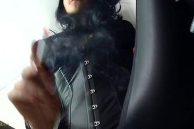 Bitchy ice queen smokes whilst wearing leather