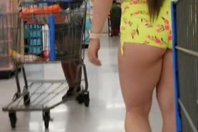 Candid ass in short shorts walking in the store