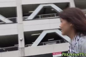 Asian teen pees on street in public
