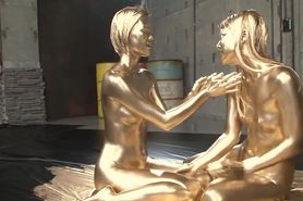 Asian lesbians paint each other gold
