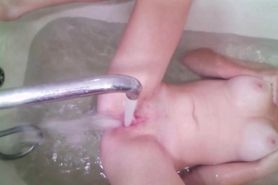 Belarusian Teen masturbates pussy with a stream of water in the bathroom