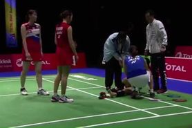 Graceful japanese badminton player foot hurt