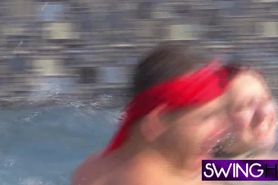 Summer fun with horny swinger couples playing naked in the water