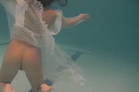 White moth in a dress underwater