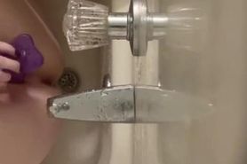 Girl gets frustrated with her dildo in shower, fingers herself instead
