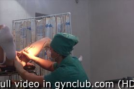 A girl is examined by a gynecologist