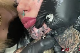 ALTEROTIC - Australian bombshell Amber Luke gets a new chin tattoo