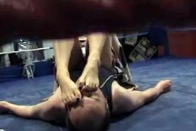 Sexy Asian girl suffocates guy with her feet in wrestling match