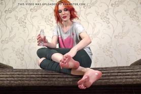 Red headed teen pours oil all over her sexy feet and long toes (JOI)
