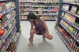 Girl Squats in the Store without Panties