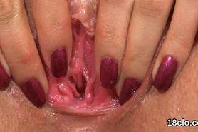 Lovable girl is gaping tight vagina in closeup and climaxing