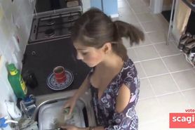 beauty exposed in down blouse while doing the dishes - video 1