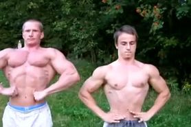 Dad bodybuilder and younger friend flex their muscles outdoor