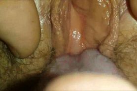 Giving oral sex to a hairy pussy