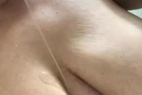 Busty Latina masturbates in shower
