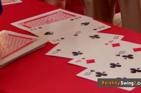 Couples play card games before heading out to swing in the red room