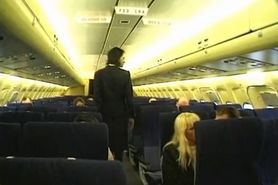 Brunette beauty wearing stewardess uniform gets fucked on a plane