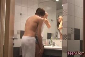 Slim teenager enjoys sex in a bathroom