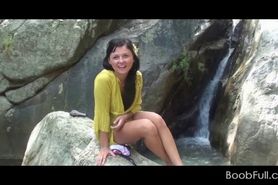Amateur teen babe working her lusty twat by a waterfall - video 1
