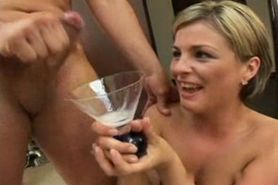 Blonde collects cum in a wine glass